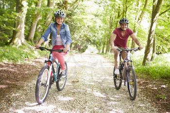 Young Couple On Cycle Ride In Countryside