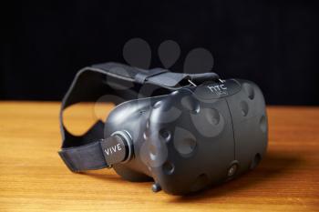 HTC Vive Virtual Reality Headset On Wooden Background