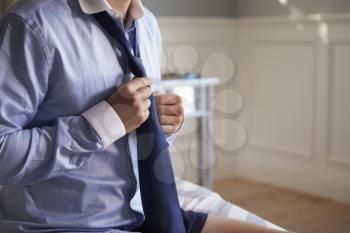 Businessman Getting Dressed For Work In The Morning