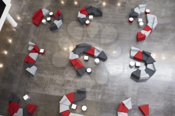 Seating in the atrium of modern university building, aerial