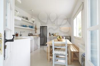 Modern Kitchen Viewed Through Open French Windows