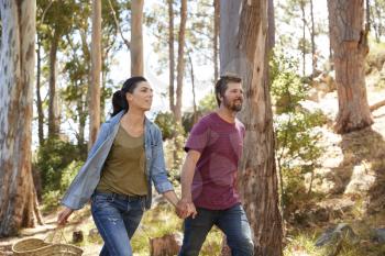 Romantic Couple Hiking Along Forest Path Together