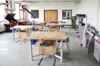 View Of Work Benches And Machinery In High School Design And Technology Classroom