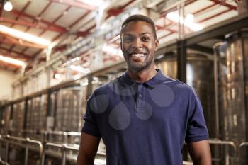 Portrait of a young black man working at a wine factory