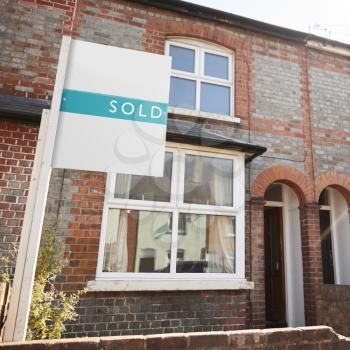 Real Estate Sold Board Outside Terraced House