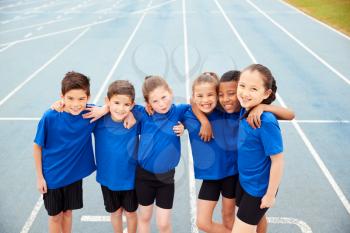 Portrait Of Children In Athletics Team On Track On Sports Day