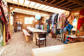 Interior View Of Communal Room On Glamping Camp Site With Vintage Clothing