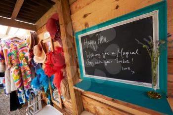 Sign In Communal Room On Glamping Camp Site With Vintage Clothing
