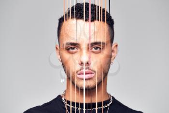 Mental Health Concept With Portrait Of Young Man With Face Obscured By Vertical Lines