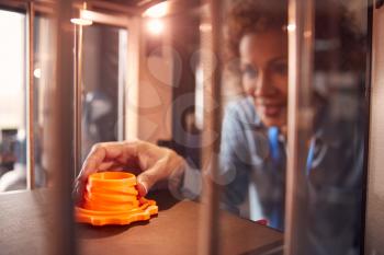 Mature Female College Student Studying Engineering Using 3D Printing Machine