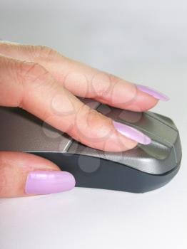 Female hand on mouse