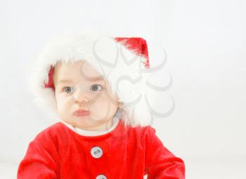 Little boy not happy at playing santa