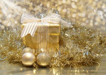 Christmas background with golden gift with sparkly stars