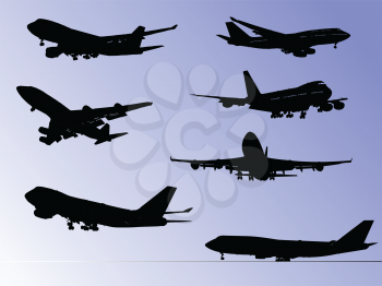 Royalty Free Clipart Image of Airplane Silhouettes on Purple