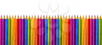 Watercolor pencils in rainbow colors over white background