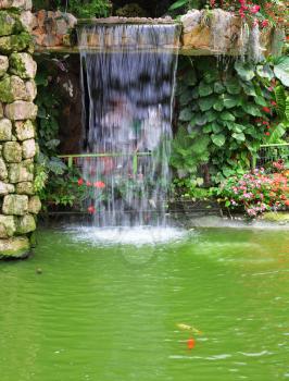 Royalty Free Photo of a Waterfall in a Pond