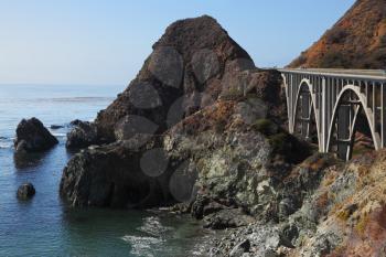 Majestic viaduct on the highway on the picturesque shore of the Pacific Ocean