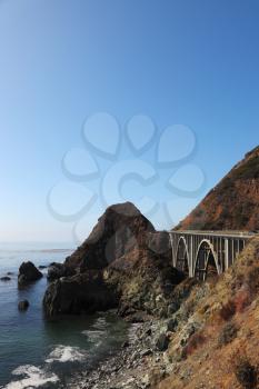 Majestic viaduct on the highway on the picturesque shore of the Pacific Ocean