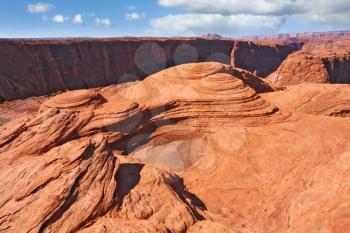 Walk around the famous Horseshoe Canyon. Colorful and fantastic cliffs of red sandstone.
