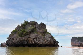  Picturesque bay in the Gulf of Thailand is surrounded by islands - rocks of various forms. Foggy morning after a heavy storm
