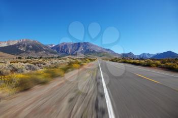 A trip at high speed through the colorful autumn desert to the distant mountains