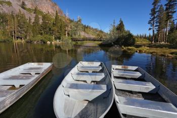 The small boat of white metal on a quiet mountain Mammoth  lake