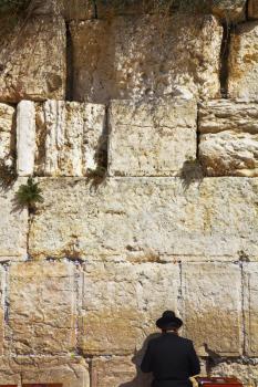 The religious Jew praying at the Western wall of the Jerusalem temple