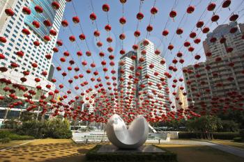 Traditional red lanterns and the modern abstract sculpture, decorating the Chinese city in New year