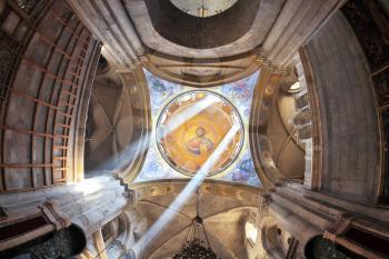  Facilities in the Holy Sepulchre.  The magnificent round arch of a ceiling is shined with two bright beams of the sun. On a ceiling image of the Christ Savior