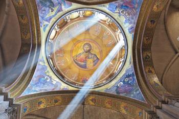  Facilities in the Holy Sepulchre.  The magnificent round arch of a ceiling is shined with two bright beams of the sun. On a ceiling image of the Christ Savior