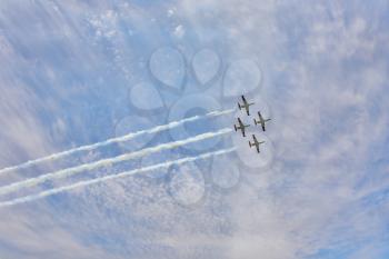 Four magnificent planes on air parade show art of synchronous flight