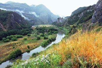 The river bends between the picturesque hills. Chilean Patagonia, the road Carretera Austral
