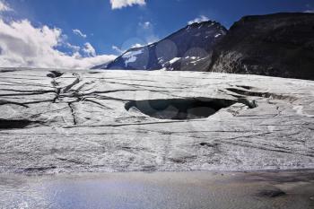 Enormous glacier in mountains of Northern Canada. Thawing edges
