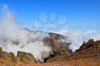 The highest peak of Madeira Island - Pico Ruyvu. A very strong wind at the top of the volcanic island of Madeira is driving the cloud