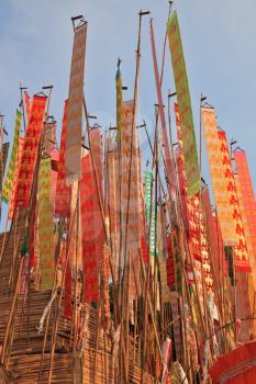 Thai New Year - Songkran. Colorful multicolored flags and pennants adorn a special bamboo tower