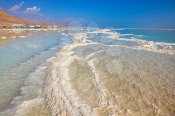 The patterns evaporated salt in the Dead Sea. Salt formed a long track with scalloped edges. Israel in October