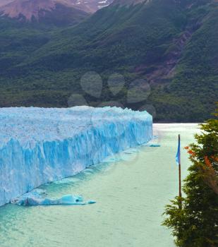 Los Glaciares National Park in Argentina. Colossal Perito Moreno glacier in Lake Argentino. Sunny and windy summer day