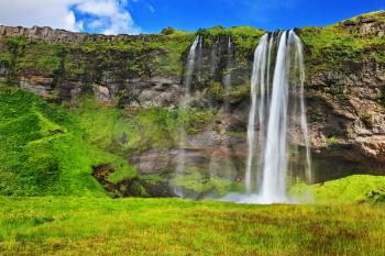 Typical landscape for the summer in Iceland. Multi waterfall Seljalandsfoss