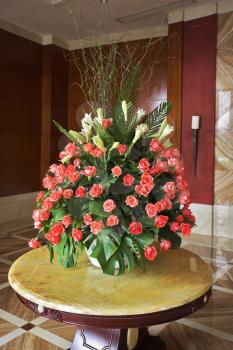 Elegant vase with flowers in a lobby of dear hotel