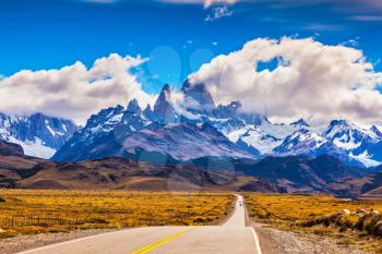 The road through desert. The highway crosses Patagonia and conducts to majestic Mountains Fitzroy
