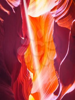 Magic ray of sunshine in the colored slit Antelope Canyon.  The Navajo reservation, Arizona, USA