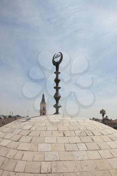 Walk on walls of ancient Jerusalem. A dome of a Muslim mosque with a half moon at top.