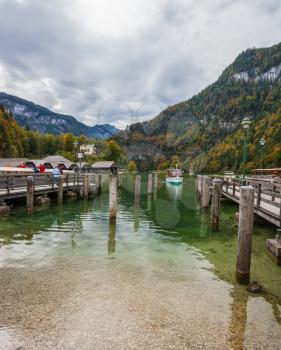 Berchtesgaden in Germany on the border with Austria. Famous lake Konigssee. Mooring for tourist pleasure boats
