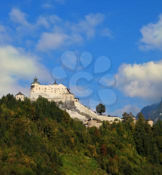 The castle is situated on top of the mountain and surrounded by dense forest.  Majestic medieval Palase Hohenwerfen