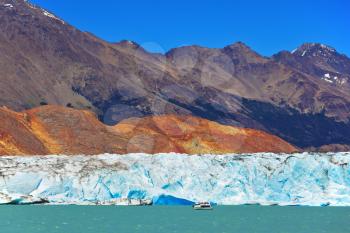 Excursion by boat to the huge white-blue glacier. Unique lake Viedma in Argentine Patagonia. The lake is surrounded by mountains