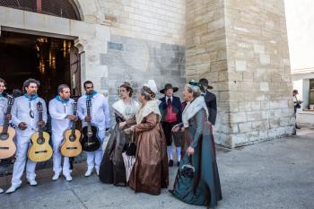 Saint-Marie-de-la-Mer, Provence, France - May 25, 2015. World Festival of Gypsies. Residents of the city in ancient costumes and a musical ensemble with guitars. Medieval cathedral of Notre Dame