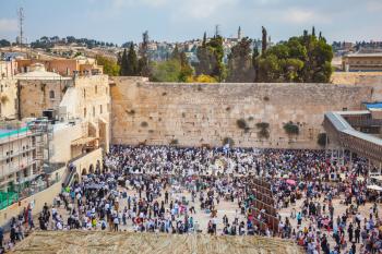 The Western Wall of the Temple. Autumn holiday of Sukkot in Jerusalem. At Temple Square was a huge crowd of Jews