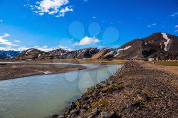  Summer floods blocked the way to the tourist camping. Central Valley in the national park Landmannalaugar, Iceland