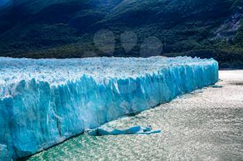  The concept of exotic and extreme tourism. The fantastic glacier Perito Moreno, in the Patagonia. Argentine Province of Santa Cruz, lake Argentine