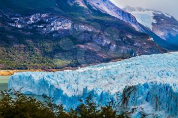 The colossal Glacier Perito Moreno on Lake Argentino in Patagonia. The concept of active and ecological tourism. Argentine province of Santa Cruz
